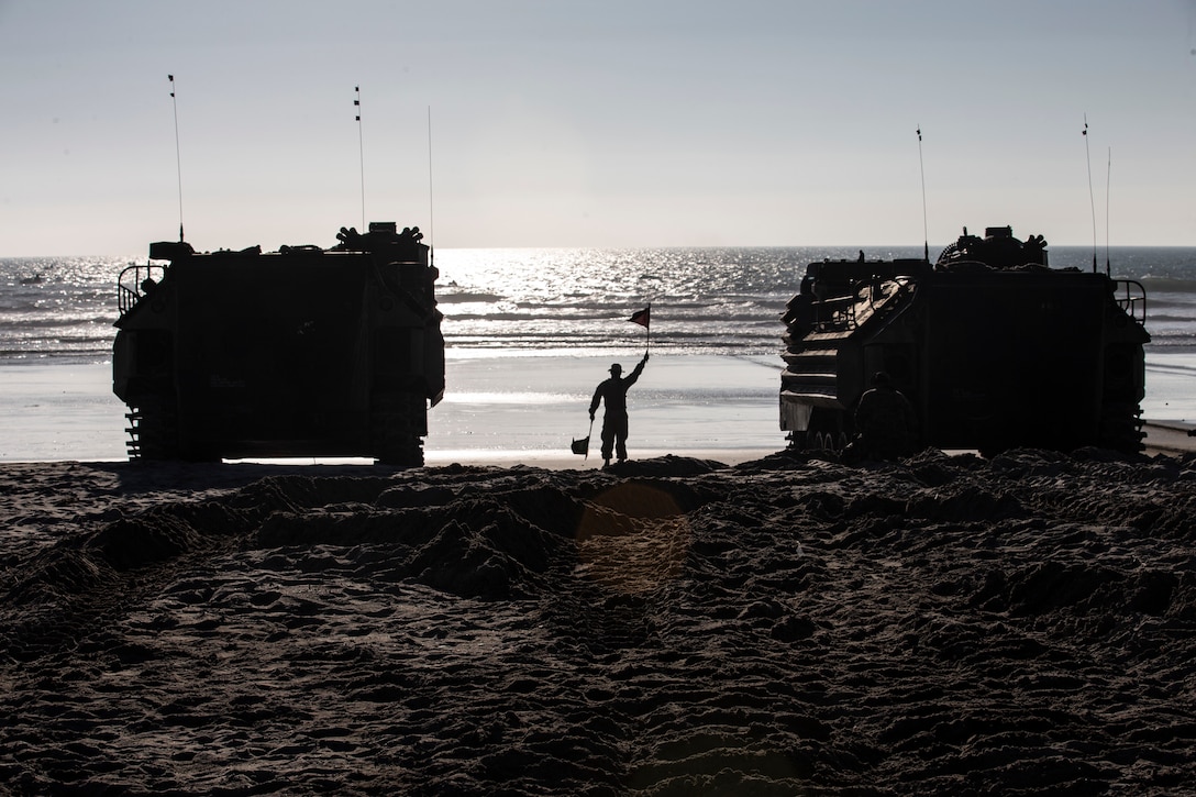 U.S. Marine Corps Staff Sgt. Robert Carretero, a section leader with 3rd Assault Amphibian Battalion, 1st Marine Division, clears an assault amphibious vehicle to enter the water during Exercise Iron Fist 2020 on Marine Corps Base Camp Pendleton, California, Jan. 23. Iron Fist is an annual, bilateral training exercise between U.S. and Japanese forces that builds their combined ability to conduct amphibious and land-based contingency operations. (U.S. Marine Corps photo by Lance Cpl. Thomas Spencer)