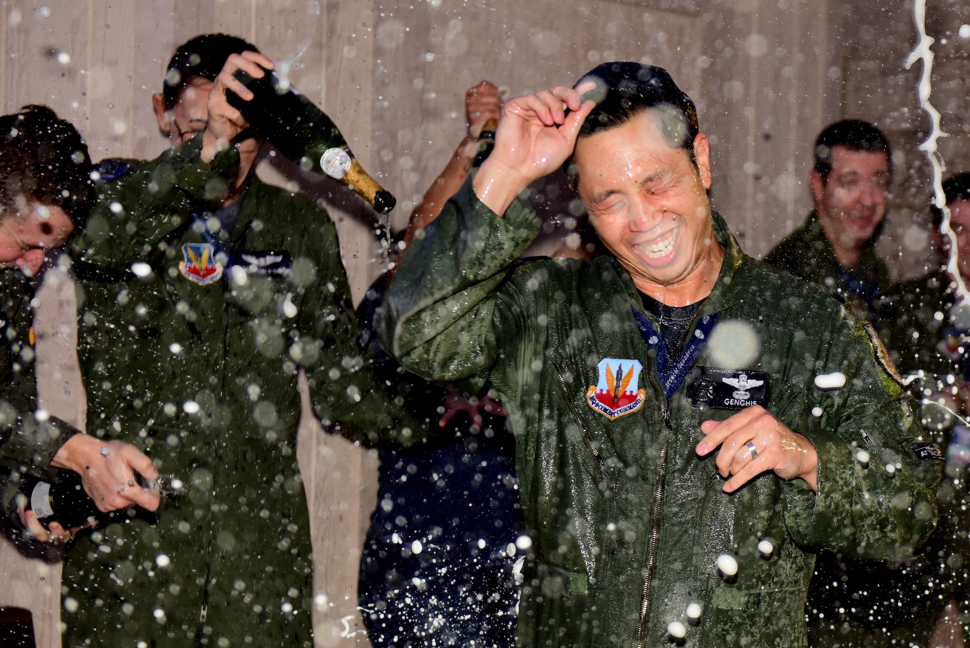 Lt. Col. Landon Quan is showered with champagne.