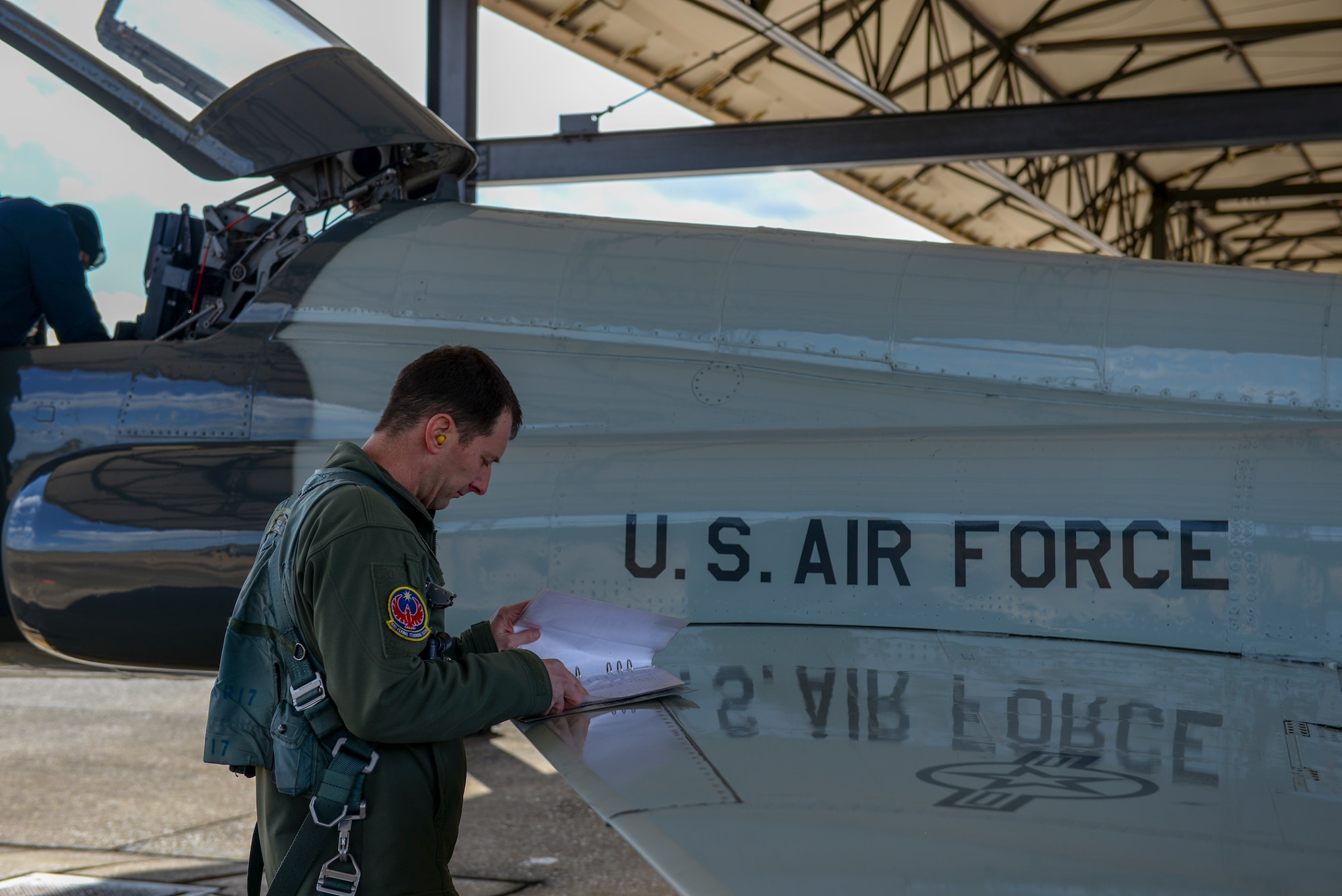 A 49th Fighter Training Squadron pilot conducts pre-flight checks on a T-38 Talon, Feb. 7, 2020, at Columbus Air Force Base, Mississippi. The pilot was a participant in exercise Southern Strike by providing aerial support in the T-38. The T-38 can reach the speed of 812 mph. (U.S. Air Force photo by Airman Davis Donaldson)