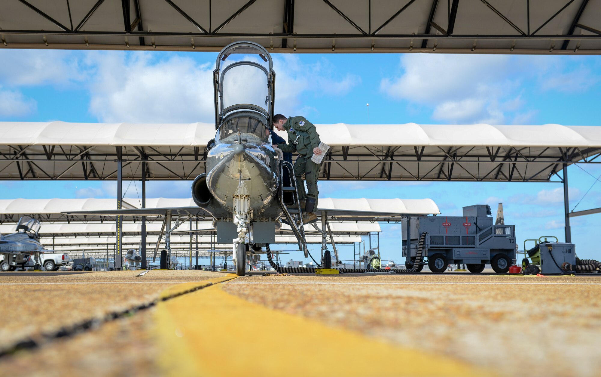 A 49th Fighter Training Squadron pilot examines the interior of a T-38 Talon Feb 7, 2020, on Columbus Air Force Base, Miss. After examining, the pilot took part in in exercise Southern Strike in Gulfport, Mississippi. The exercise is conducted to increase deployment readiness of not only U.S. military, but international allies as well. (U.S. Air Force photo by Airman Davis Donaldson)