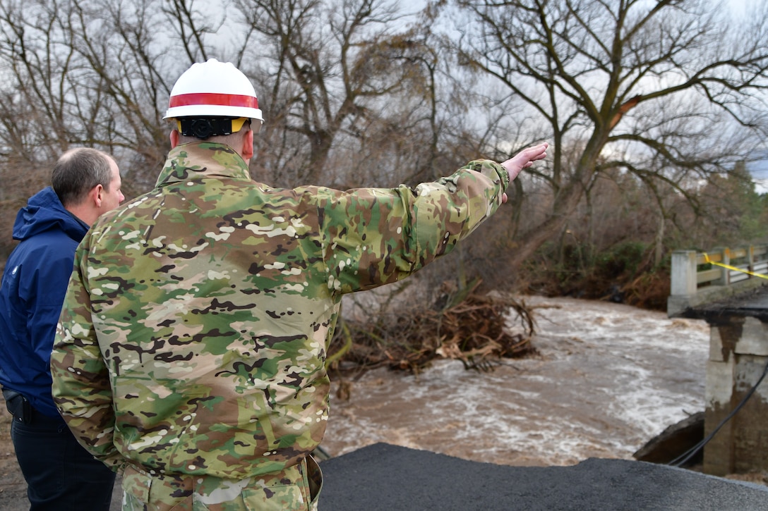 Lt. Col. Christian Dietz, Commander of the Walla Walla District Corps of Engineers, and Alan Feistner, Deputy District Engineer for the Walla Walla District Corps of Engineers, examine a bridge off Old Hwy 12 in Walla Walla.