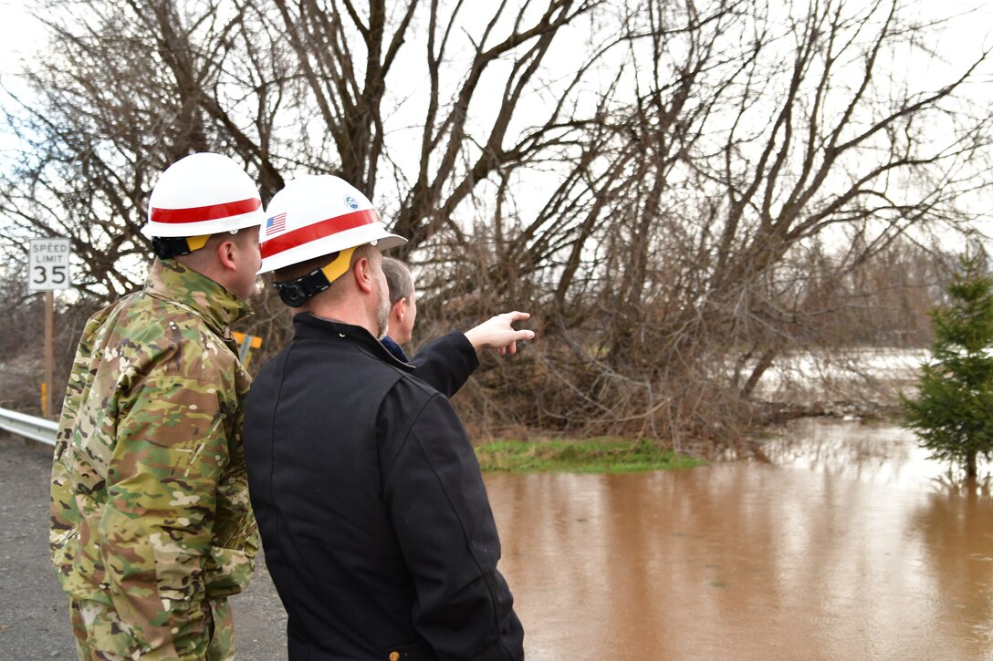 Lt. Col. Christian Dietz, Commander of the Walla Walla District Corps of Engineers, and the District's Chief of Engineering, Dwayne Weston, oversee Russel Creek in Walla Walla.