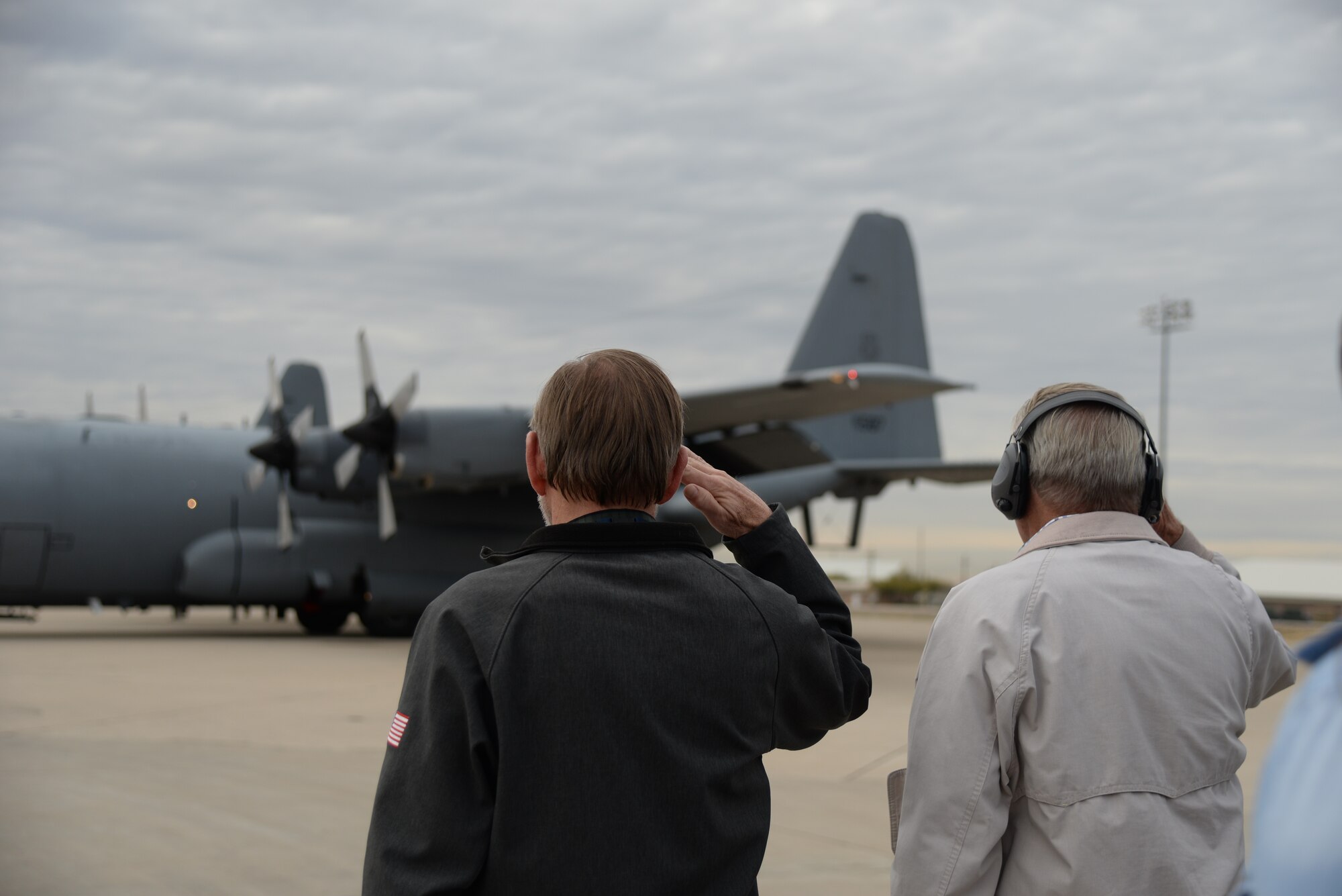 Civilian Airmen render a salute