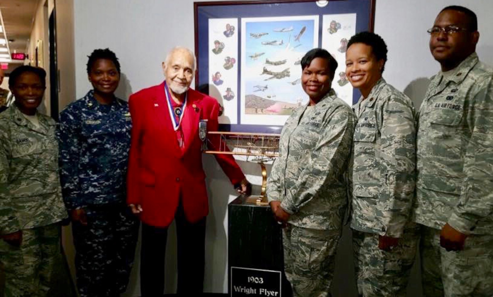 Retired U.S. Air Force Lt. Col. Leo Gray, third from left, poses for a photo with Maj. Natosha Reed, Air Command and Staff College student, third from right, and other military members during the ACSC’s 2016 Gathering of Eagles event, Maxwell Air Force Base, Alabama, May 31, 2016.
