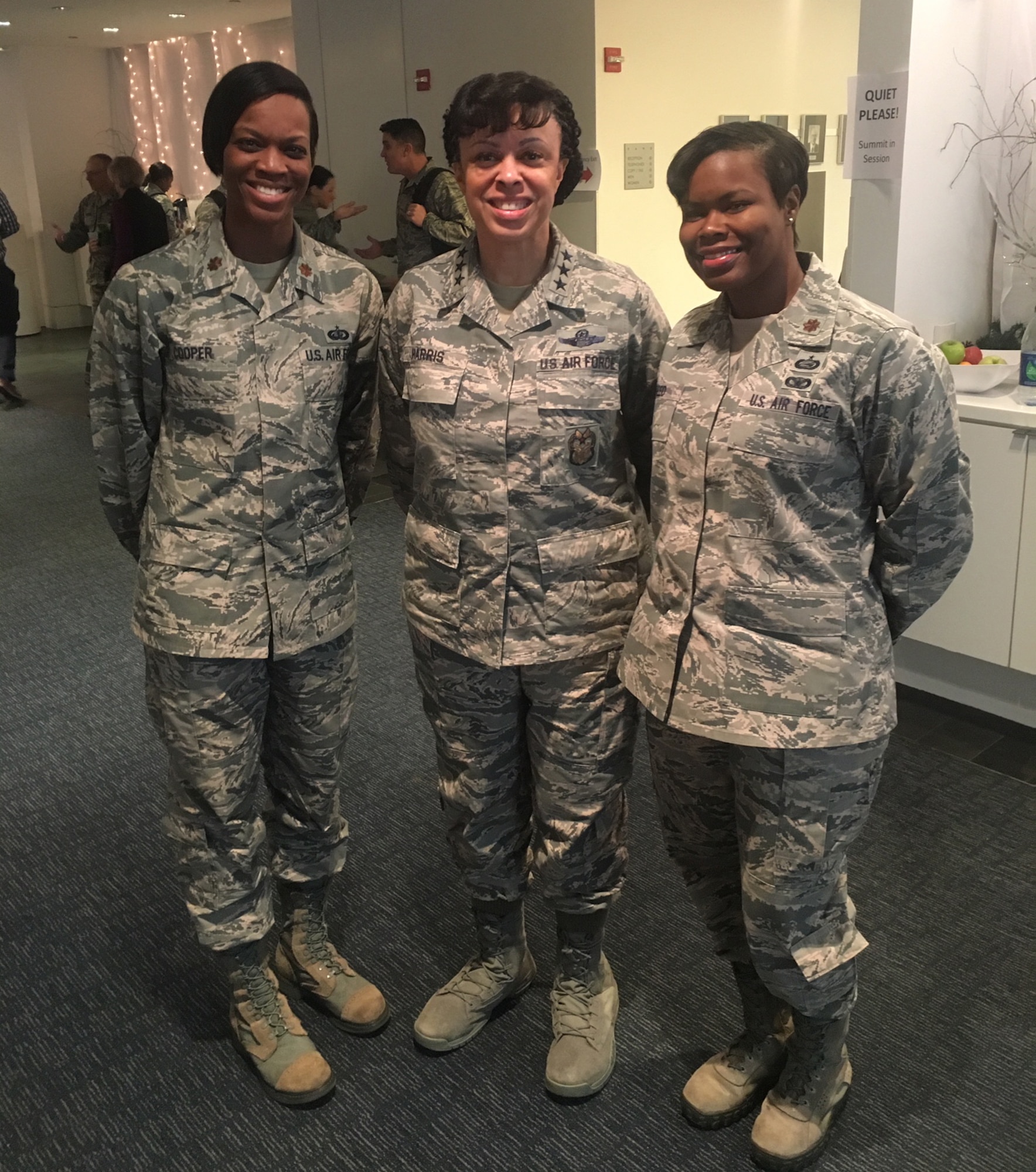 U.S. Air Force Lt. Gen. Stayce D. Harris, Inspector General of the Air Force, center, poses for a photo with Maj. Natosha Reed, U.S. Air Forces in Europe and Air Forces Africa International Affairs Operations deputy branch chief, right, and Maj. Kira Cooper, Air Force Reserve Command force development chief, left, at the Military and Civilian Workforce Summit in Washington, D.C., Dec. 12, 2017.