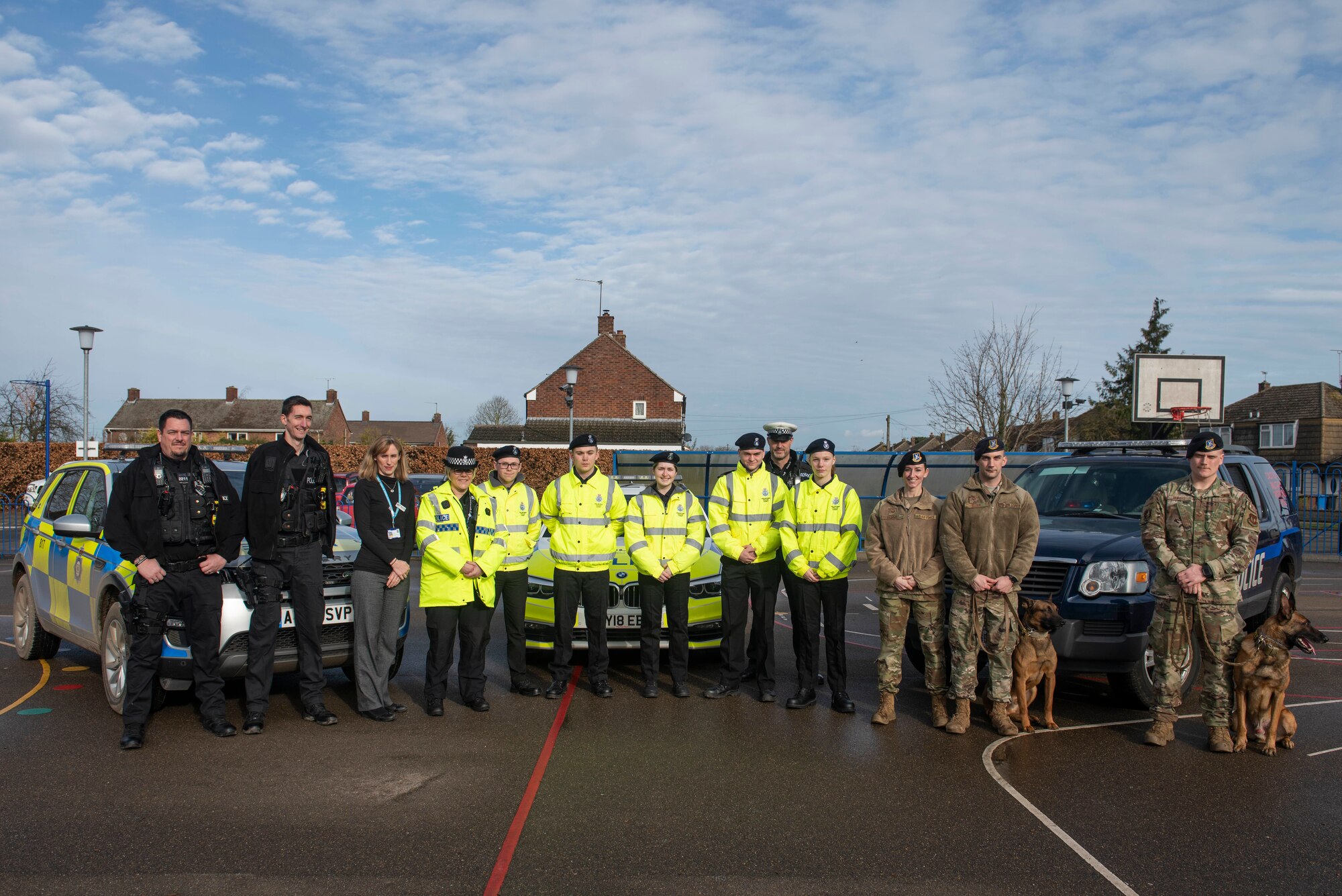Attendees of the Mildenhall police cadets’ open house pose for a group photo during an event in Mildenhall, England, Feb. 8, 2020. The open house was meant to recruit kids in the local area to join the police cadets, learn more about law enforcement and give them exciting opportunities. (U.S. Air Force photo by Staff Sgt. Luke Milano)