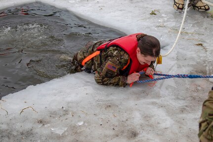 Alaska Army National Guard Command Sgt. Maj. Maureen Meehan, Joint Force Headquarters, participated in cold water immersion training organized by the 207th Engineer Utilities Detachment at Gwen Lake on Joint Base Elmendorf-Richardson, Alaska, Feb. 8, 2020. The training was developed to address the risk associated with the 207th EUD ice bridging project.