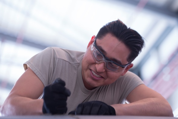 U.S. Air Force Airman 1st Class Ernesto Peralta-Carrion, 86th Maintenance Squadron aircraft inspection apprentice, scrapes sealant off a C-130J Super Hercules aircraft at Ramstein Air Base, Germany, Feb. 7, 2020. Sealant protects the wings of the planes from water and debris. The 86th MXS works around the clock to make sure the base’s C-130’s are maintained and ready to fly at all times.