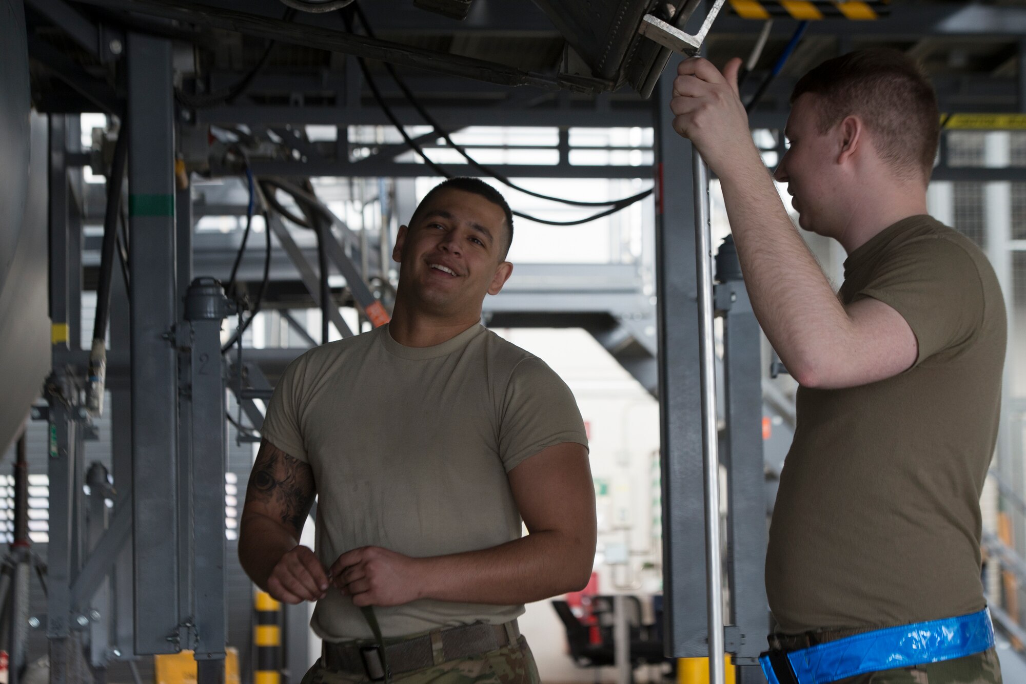 U.S. Air Force Staff Sgt. Chandler Bitterman, 86th Aircraft Maintenance Squadron dedicated crew chief, left, and Staff Sgt. Paul Michael, 86th Maintenance Squadron repair and reclamation craftsman, talk while working at Ramstein Air Base, Germany, Feb. 5th, 2020. Maintaining a C-130J Super Hercules aircraft requires the cooperation of various maintenance flights including engine, electrician, arrow repair, and wheel and tire flights. The 86th MXS works around the clock to make sure the base’s C-130’s are maintained and ready to fly at all times.