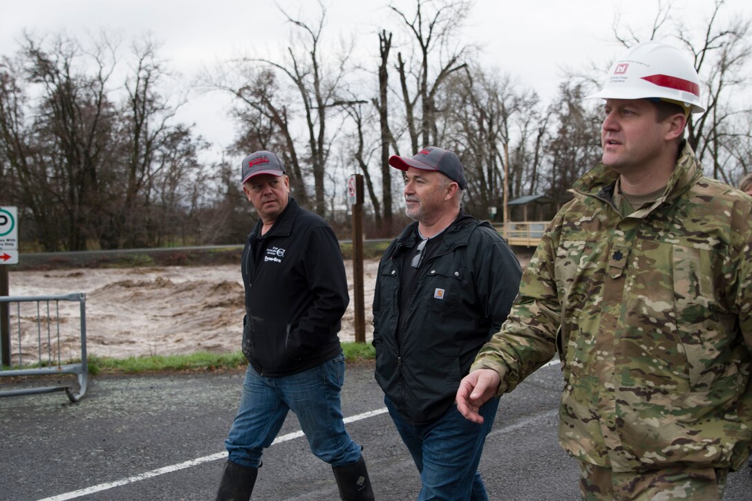 County Commissioners Todd Kimball and Greg Tompkins and Lt. Col. Christian Dietz, Commander of the Walla Walla District Corps of Engineers, travel along the Mill Creek Channel.