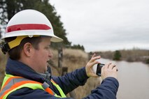 Engineer Alex Hammond, a Dam and Levee Safety Manager for the Walla Walla District Corps of Engineers monitors Bennington Lake levels.