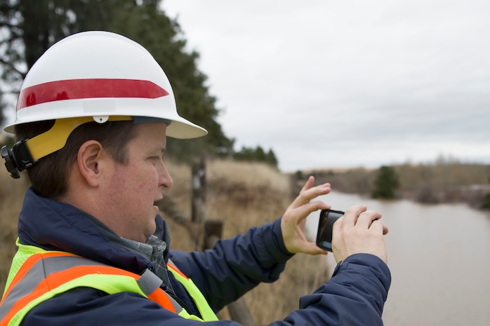 Engineer Alex Hammond, a Dam and Levee Safety Manager for the Walla Walla District Corps of Engineers monitors Bennington Lake levels.