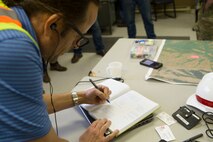 Jeffrey Bonafilia, Planning Study Specialist, for the Walla Walla Corps of Engineers recording incoming flows of the Mill Creek Channel.