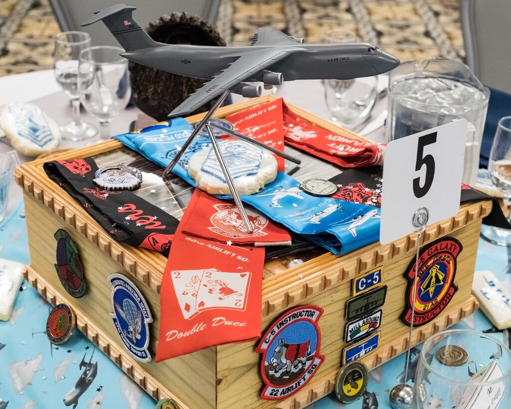 The table of Senior Master Sgt. Jeremy Frappier, 436th Wing Staff Agency superintendent, displays some of his career memorabilia at the Chief Master Sergeant Recognition Ceremony at the Landings, Feb. 8, 2020, on Dover Air Force Base, Del. Those to be honored could choose to personalize their tables for the ceremony. (U.S. Air Force photo by Roland Balik)