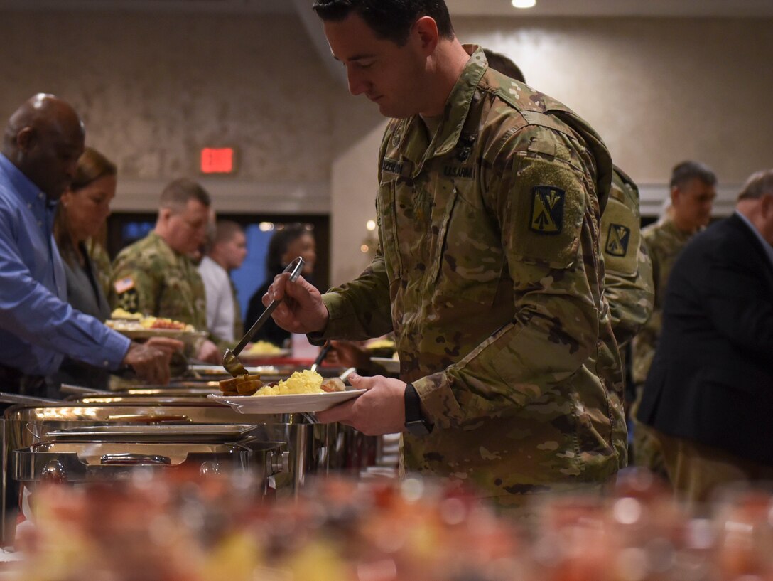 Event attendees serve themselves food during the National Prayer Breakfast event at Joint Base Langley-Eustis, Virginia, Feb. 11, 2020.