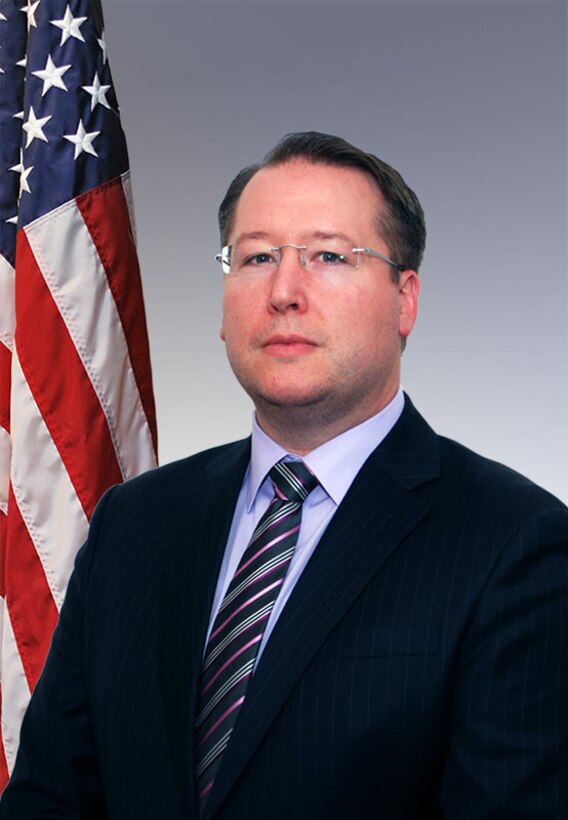 Portrait shot of a man wearing a business suit.