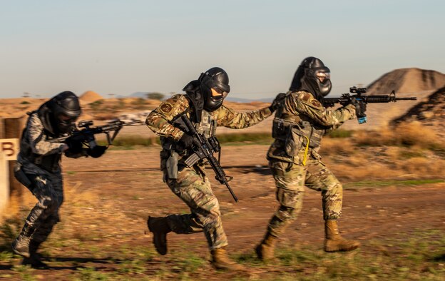 56th Security Forces Squadron defenders move quickly toward cover during Shoot, Move and Communicate training Dec. 12, 2019, at Luke Air Force Base, Ariz.