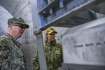 Rear Adm. Kristen B. Fabry, director, Logistics, Fleet Supply and Ordnance, U.S. Pacific Fleet, speaks with Sailors from Navy Munitions Command East Asia Division (NMCPAC EAD) Unit Misawa during a tour of the command. NMCPAC EAD maintains underwater mines, torpedoes, and provides ordnance sentencing, inspection and handling in support of aviation ordnance operations.