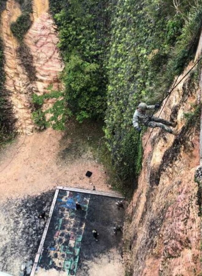 A Lance Corporal of 2nd Platoon, Company C, 1st Battalion, 4th Marines conducts a cliff rappel while conducting training at Jungle Warfare Training Center, Okinawa Japan, April 102019.