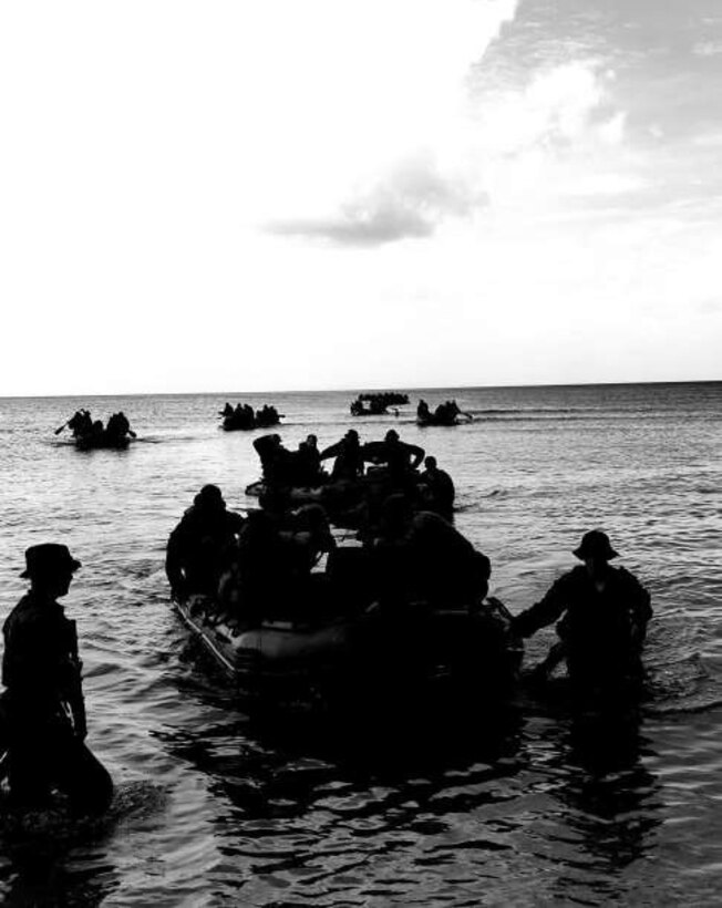 Company A, Battalion Landing Team 1/4, 31st Marine Expeditionary Unit, conducts an amphibious landing by small boat at Dadi Beach, Naval Base Guam, the same landing area that 1st Battalion, 4th Marines landing at during the liberation of Guam in World War II. Company A was tasked with being the Small Boat Raid Company of the 31st MEU during their deployment, and sent Marines to several weeks of rigorous instruction at Expeditionary Warfare Training Group –Pacific, in Coronado, California, to learn the skills needed to carry out this mission. Marines from Company A became highly skilled Small Boat Coxswains, Small Boat and Engine Mechanics, Scout Swimmers and Maritime Navigators, helping the Company become a successful clandestine small boat raid force during deployment.