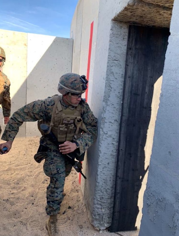 A Private First Class from Company B, 1st Battalion, 4th Marines, 1st Marine Division (Rein), throws a M69 practice hand grenade during a live fire exercise at Integrated Training Exercise, Twenty-Nine Palms, California on Jan. 30,2020.