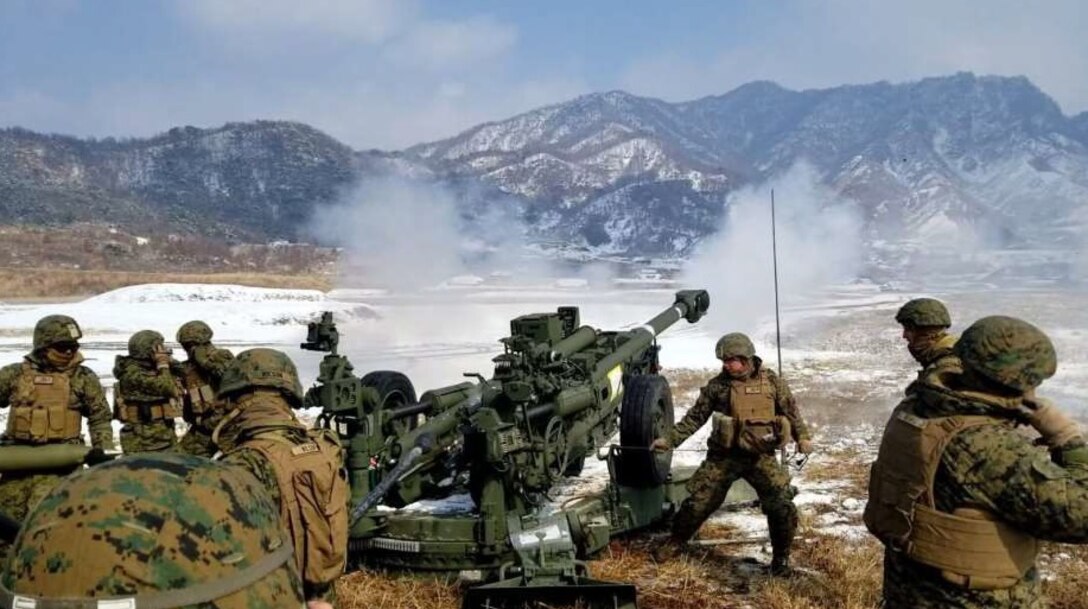 The U.S. Marines of Battery E, Battalion Landing Team, 1st Battalion, 4th Marines, 31st Marine Expeditionary Unit, conduct direct fire at Rodriguez Live Fire Complex (RLFC), Republic of Korea. Three Gun Crews competed, engaging in a target (a 10x40 ft CONEX box) at 1500 meters.