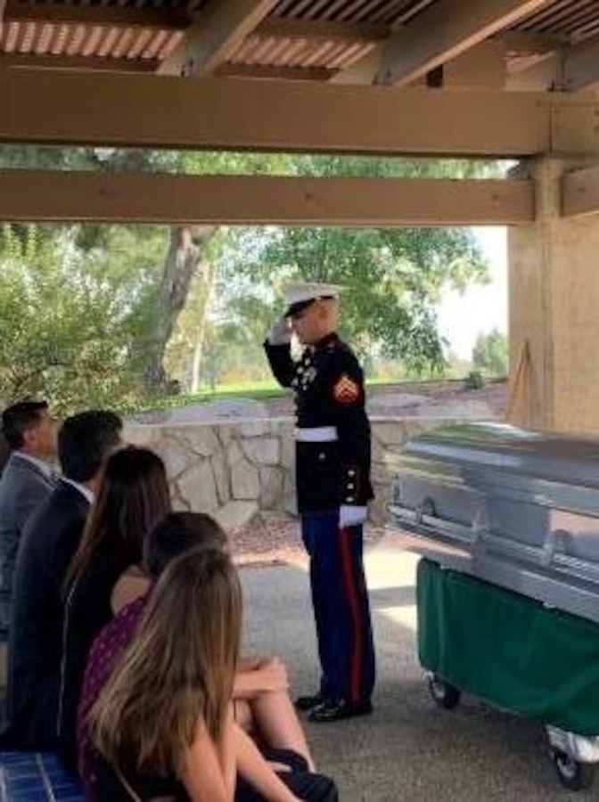 A Corporal from Weapons Company, 1st Battalion, 4th Marines, 1st Marine Regiment, conducts a memorial service for a veteran at Riverside National Cemetery, Riverside, California, Oct. 10, 2020. 1st Battalion, 4th Marines regularly participate in volunteer activities strengthening the bond between the USMC and the local community.