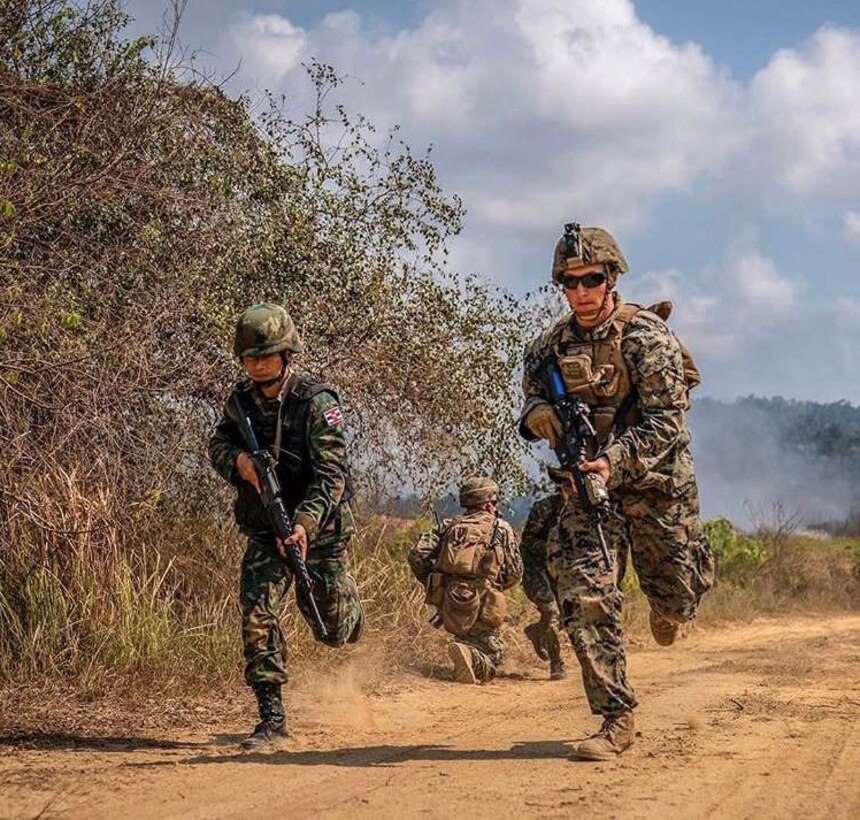 A Royal Thai Marine and a U.S. Marine of Combat Engineer Platoon, 1st Battalion, 4th Marines, 1st Marine Regiment, run back to an assault amphibious vehicle during Exercise Cobra Gold 2019 at Ban Chan Krem, Kingdown of Thailand, Feb. 19,2019.
Combat Engineer Platoon worked hand in hand with the Royal Thai Marine Corps Combat Engineers to execute a live fire Bangalore breach in support of the Final Exercise. (U.S. Marine Corps photo by Staff Sgt. Matthew J.Bragg)