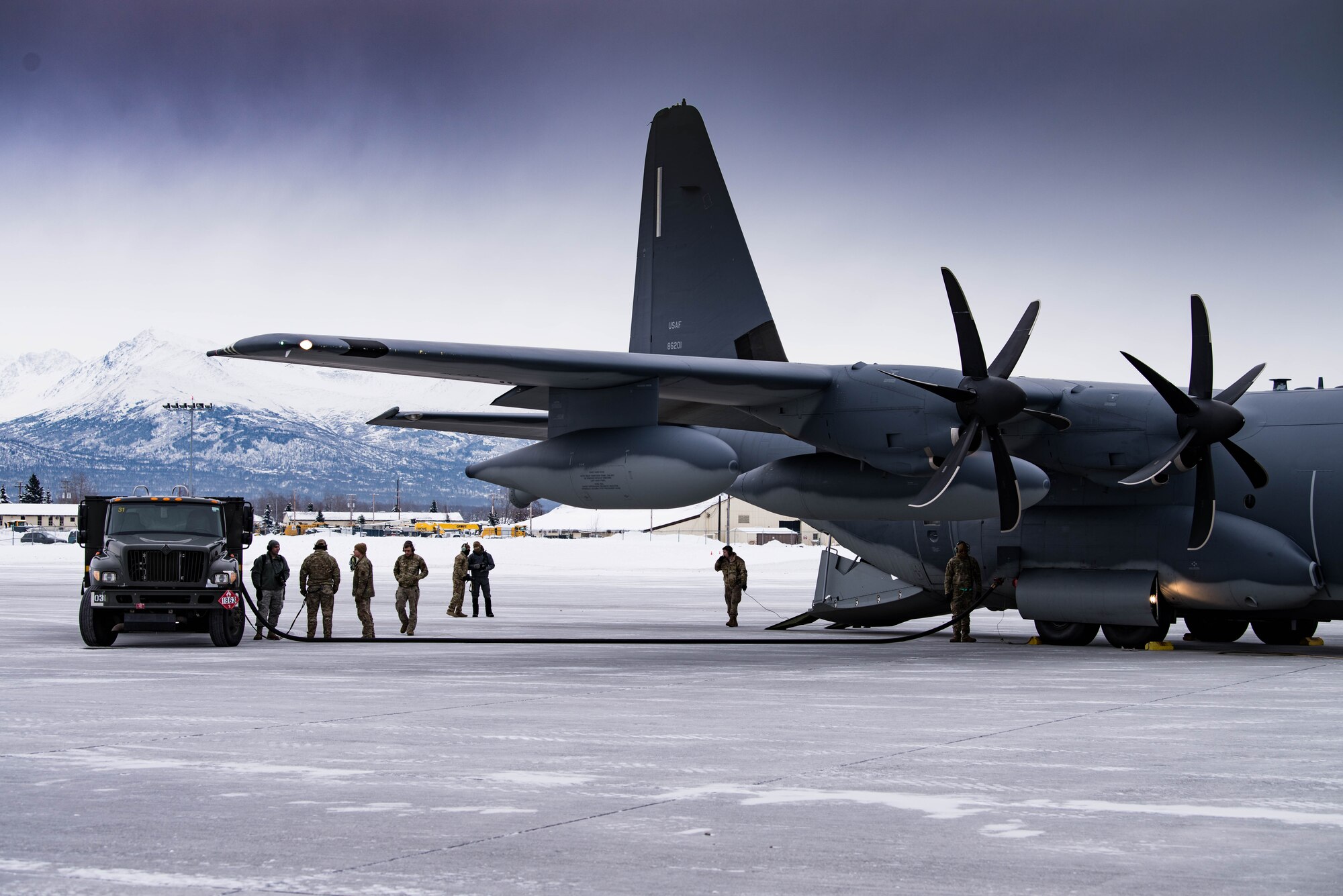 Airmen from Cannon Air Force Base’s 27th Special Operations Logistics Readiness Squadron forward area refueling point team prepare for the operation of refueling two F-22 Raptor aircraft by an MC-130J Commando II aircraft during exercise Emerald Warrior at Joint Base Elmendorf-Richardson, Alaska, Jan. 29, 2020. This training marked the first time FARP capabilities were tested in an arctic environment. (U.S. Air Force Photo by Senior Airman Marcel Williams)