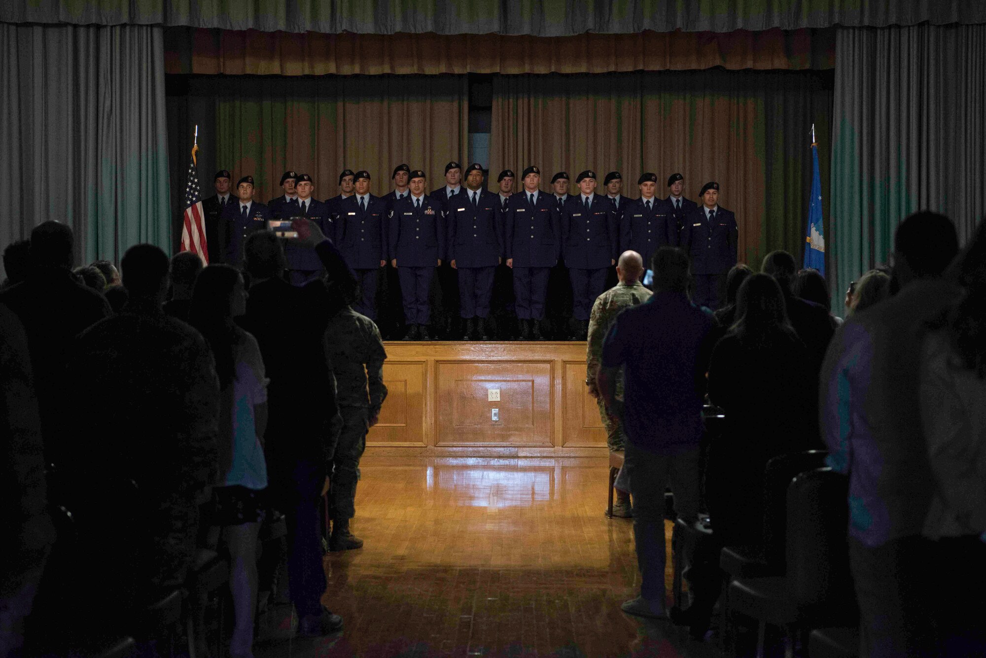 Tactical Air Control Party graduates from class Hawk 110 stand at attention after receiving their TACP beret at Joint Base San Antonio-Lackland, Texas, Dec. 13, 2019. The next step for the graduates is attending U.S. Air Force Survival, Evasion Resistance and Escape (SERE) school at Fairchild Air Force Base, Washington, for the next three weeks. There, graduates will learn the procedures, equipment and techniques needed to survive regardless of climatic conditions or dangerous environments. (U.S. Air Force photo by Senior Airman Marco A. Gomez)