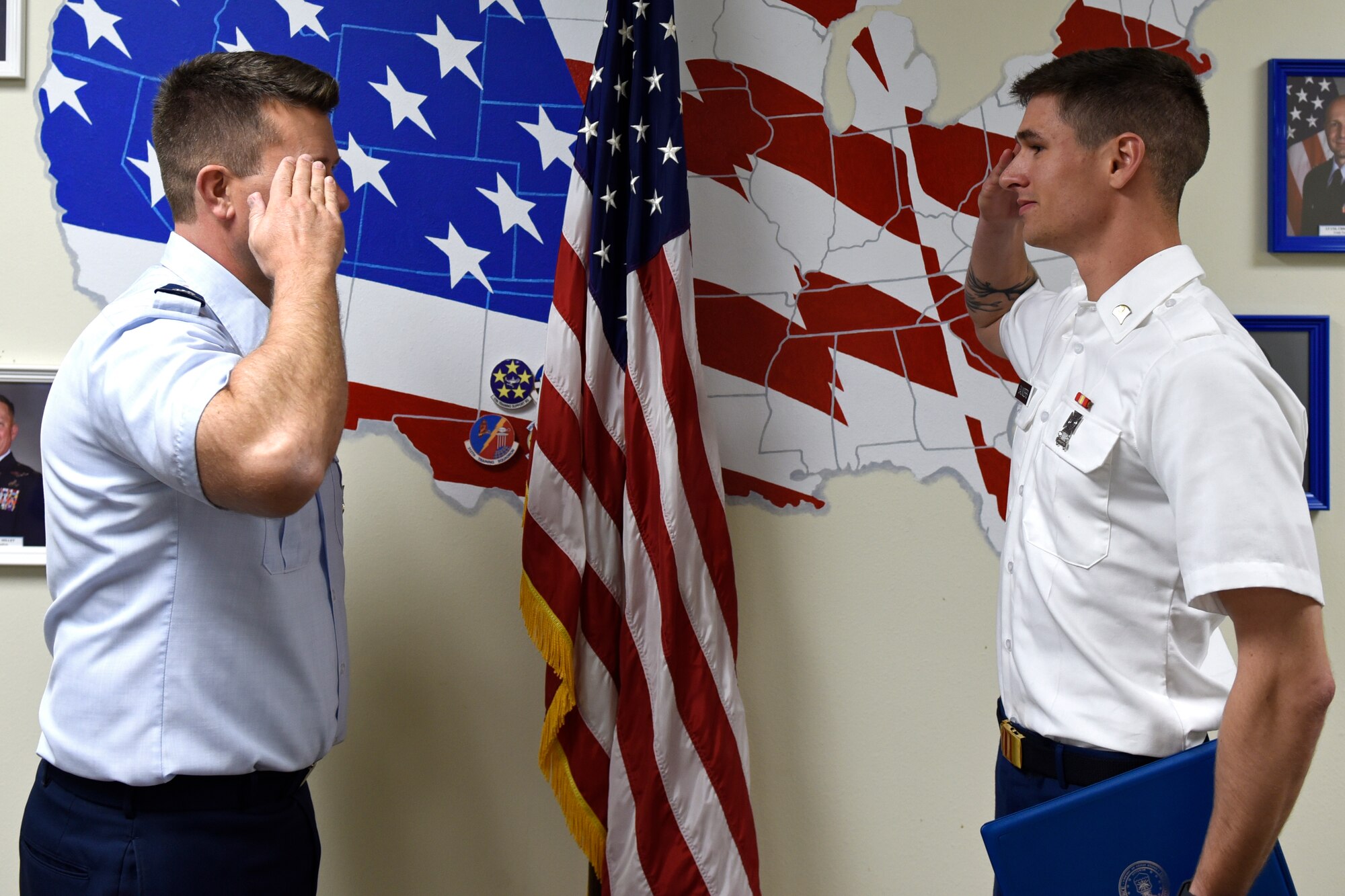 U.S. Air Force Lt. Col. Michael McCourt, 312th Training Squadron commander, salutes U.S. Army Specialist Coleton Saunders, 169th Engineer Battalion student, after presenting him with the 312th TRS Student of the Month Award at Brandenburg Hall on Goodfellow Air Force Base, Texas, Feb. 7, 2020.  The 312th TRS’s mission is to provide Department of Defense and international customers with mission ready fire protection and special instruments graduates and provide mission support for the Air Force Technical Applications Center. (U.S. Air Force photo by Senior Airman Zachary Chapman)