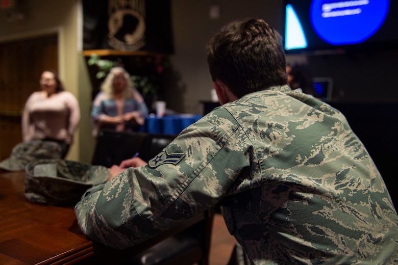Photo of a focus group participant listening to event speakers.