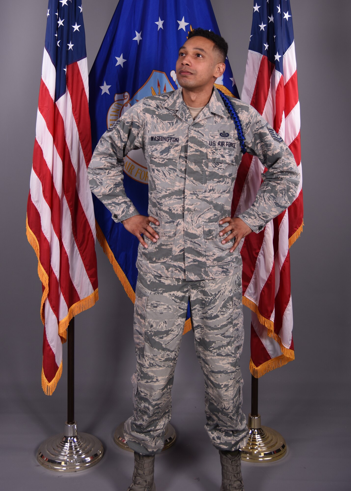 U.S. Air Force Tech. Sgt. Joseph Washington, 315th Training Squadron assistant flight chief and master MTL, displays his new royal and dark blue colored aiguillette in the 17th Training Wing Public Affairs photo studio on Goodfellow Air Force Base, Texas, Feb. 12, 2020. The aiguillette physically distinguishes Washington as a beacon to mentor, train and lead not only technical training students, but other MTLs. (U.S. Air Force photo by Airman 1st Class Abbey Rieves)