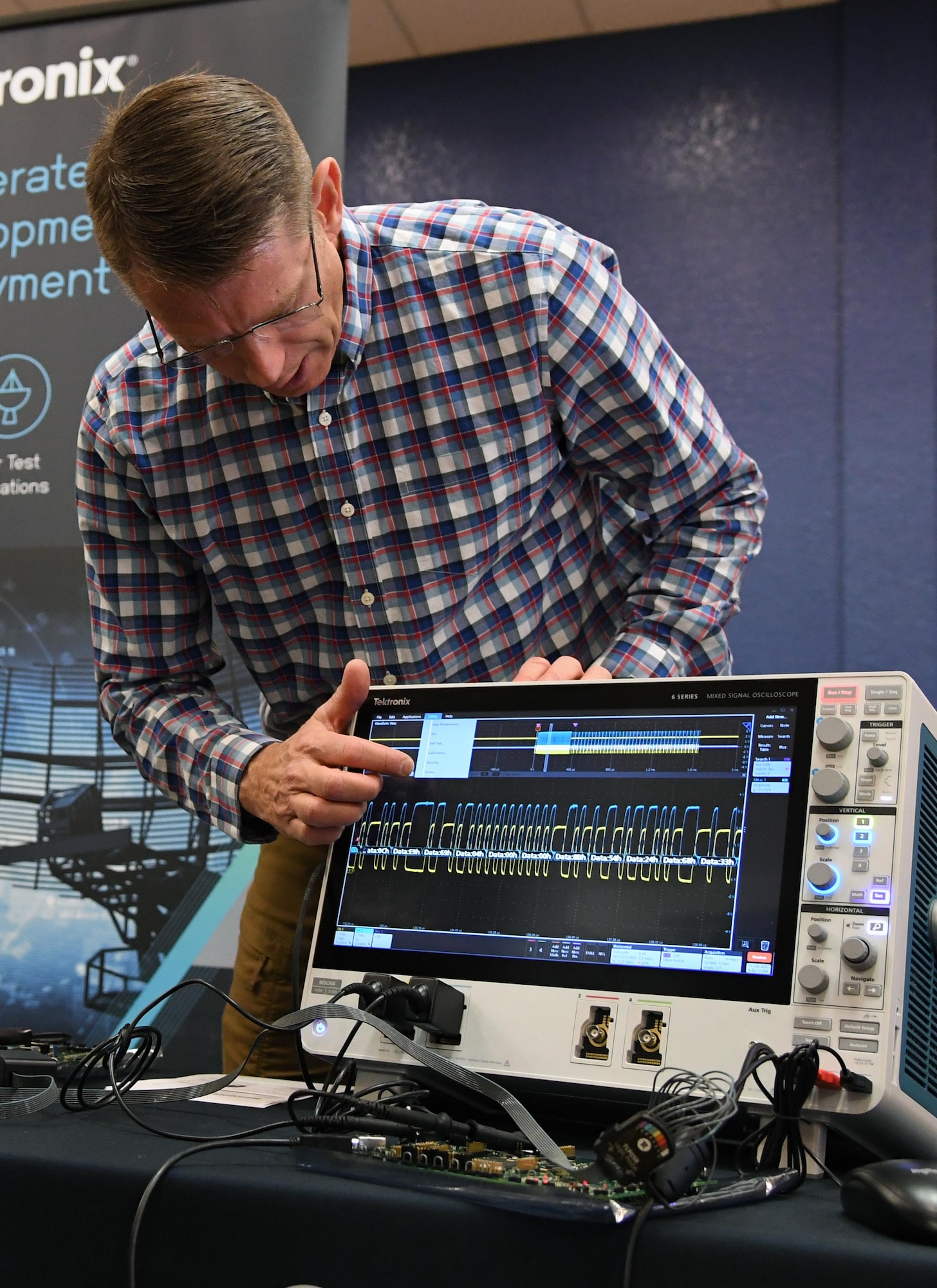 Larry Shemetulskis, Tektronix southeast U.S. channel manager, briefs on the operations of an oscilloscope used for analyzing electromagnetic signals during the Annual Keesler Air Force Base Tech Expo inside the Bay Breeze Event Center at Keesler Air Force Base, Mississippi, Feb. 11, 2020. The expo, hosted by the 81st Communications Squadron, was held to introduce military members to the latest in technological advancements to bolster the Air Force�s capabilities in national defense. (U.S. Air Force photo by Kemberly Groue)