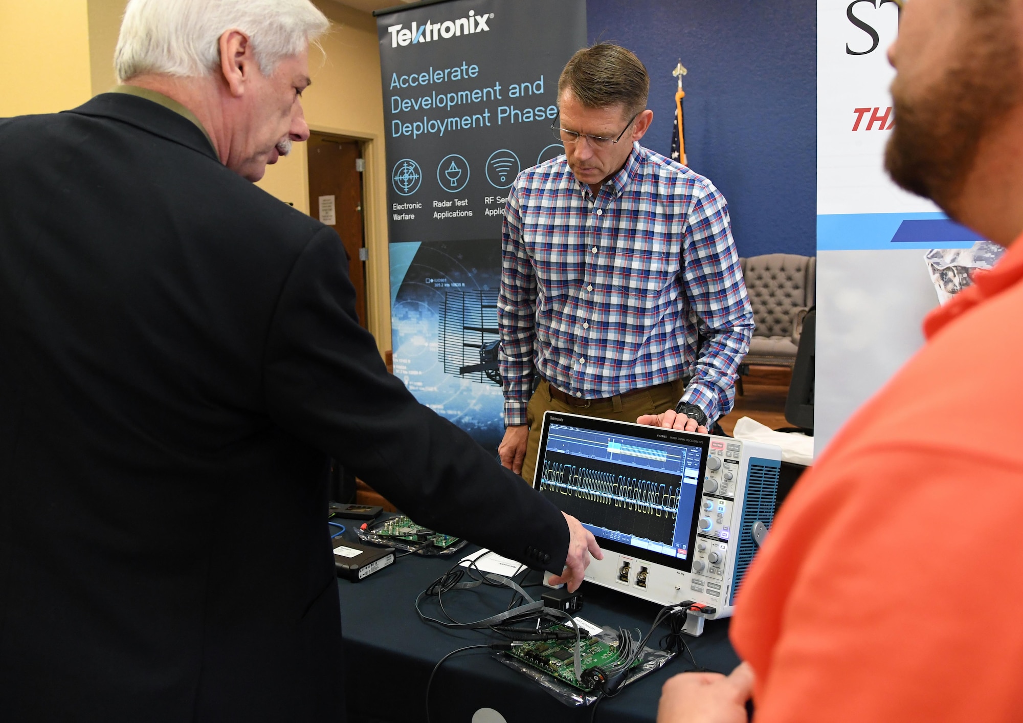 Randal Blanchard, 85th Engineering Installation Squadron electronics engineer, asks Larry Shemetulskis, Tektronix southeast U.S. channel manager, questions about the operations of an oscilloscope, which is used for analyzing electromagnetic signals, during the Annual Keesler Air Force Base Tech Expo inside the Bay Breeze Event Center at Keesler Air Force Base, Mississippi, Feb. 11, 2020. The expo, hosted by the 81st Communications Squadron, was held to introduce military members to the latest in technological advancements to bolster the Air Force�s capabilities in national defense. (U.S. Air Force photo by Kemberly Groue)