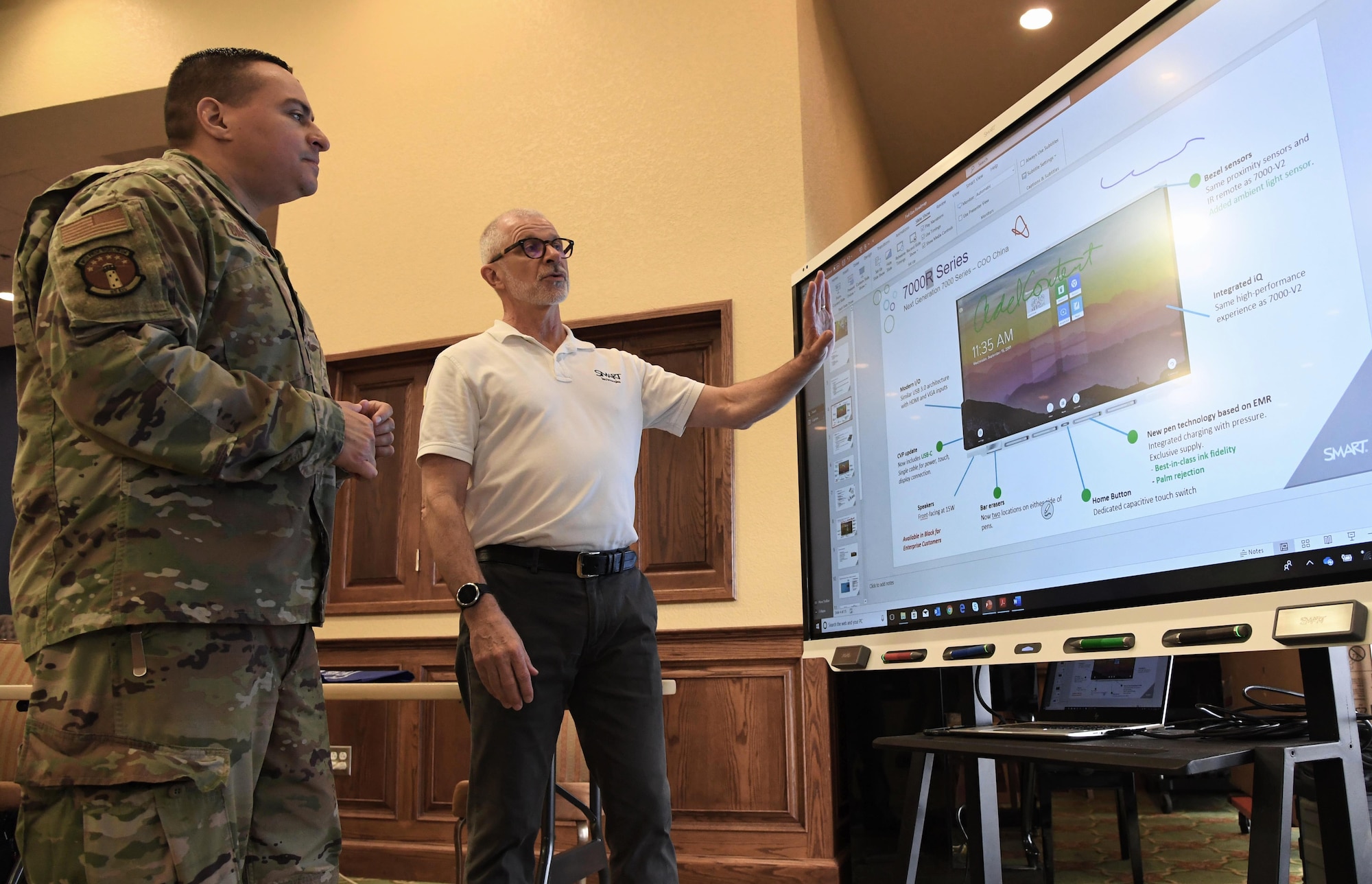 Gary Waliszewski, SMART Technologies federal systems group manager, explains the smart board training capabilities to U.S. Air Force Lt. Col. Nelson Caraballo, 85th Engineering Installation Squadron commander, during the Annual Keesler Air Force Base Tech Expo inside the Bay Breeze Event Center at Keesler Air Force Base, Mississippi, Feb. 11, 2020. The expo, hosted by the 81st Communications Squadron, was held to introduce military members to the latest in technological advancements to bolster the Air Force�s capabilities in national defense. (U.S. Air Force photo by Kemberly Groue)