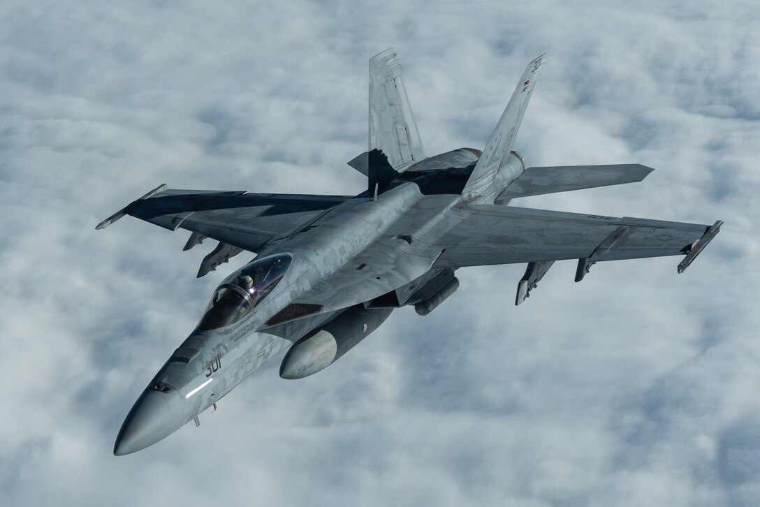 A U.S. Navy F/A-18E Super Hornet assigned to the Carrier Air Wing (CVW) 5 conducts aerial refueling operations with the 909th Air Refueling Squadron during exercise WestPac Rumrunner Jan. 10, 2020, out of Marine Corps Air Station Iwakuni, Japan. The new training exercise was developed for Team Kadena Airmen to improve lethality and interoperability and further develop operational concepts, ensuring multi-capable Airmen are postured in a position of advantage to generate combat power. (U.S. Air Force photo by Senior Airman Cynthia Belío)