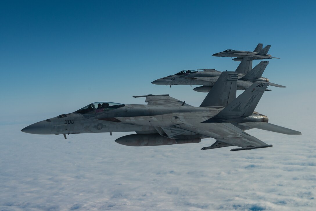 Three U.S. Navy F/A-18E Super Hornets assigned to the Carrier Air Wing (CVW) 5 conduct aerial refueling operations with the 909th Air Refueling Squadron during exercise WestPac Rumrunner Jan. 10, 2020, out of Marine Corps Air Station Iwakuni, Japan. The exercise brought Airmen and joint partners together to train and execute innovative ways to deploy forces in a contested environment. (U.S. Air Force photo by Senior Airman Cynthia Belío)
