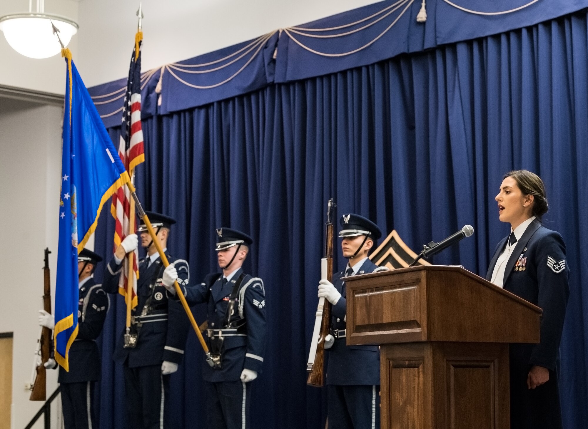Staff Sgt. Alicia Garcia, 436th Force Support Squadron Airman Leadership School instructor, sings the national anthem during the Chief Master Sergeant Recognition Ceremony at the Landings, Feb. 8, 2020, on Dover Air Force Base, Del. The Dover Air Force Base Honor Guard posted the colors at the beginning of the ceremony. (U.S. Air Force photo by Roland Balik)