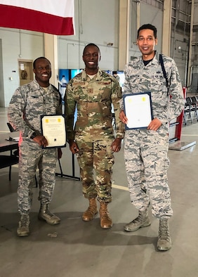 U.S. Air Force Tech. Sgt. Derwin Finley, 312th Training Squadron assistant flight chief and master military training leader, Chief Master Sgt. Lavor Kirkpatrick, 17th Training Wing command chief and Tech. Sgt. Joseph Washington, 315th Training Squadron assistant flight chief and master MTL pose for a congratulatory photo in the Louis F. Garland Department of Defense Fire Academy High Bay on Goodfellow Air Force Base, Texas, Feb. 7, 2020.  Finley and Washington became the first Master Military Training Leaders in the Air Education and Training Command. (Courtesy photo)