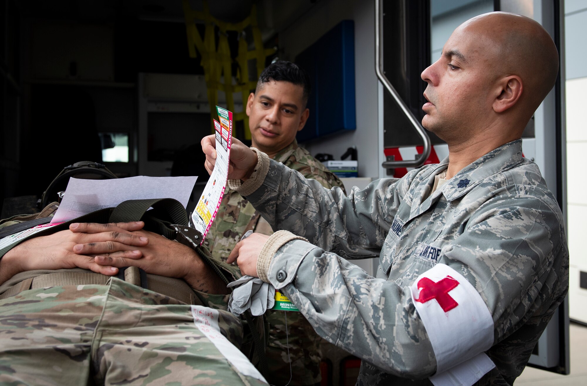 Image of two Airmen completing a medical exercise.