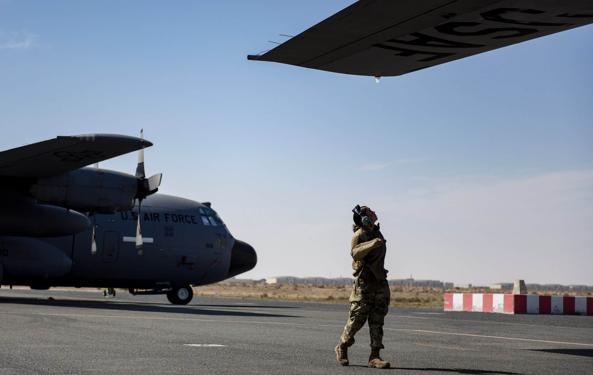 An Airplane sits on the flightline.