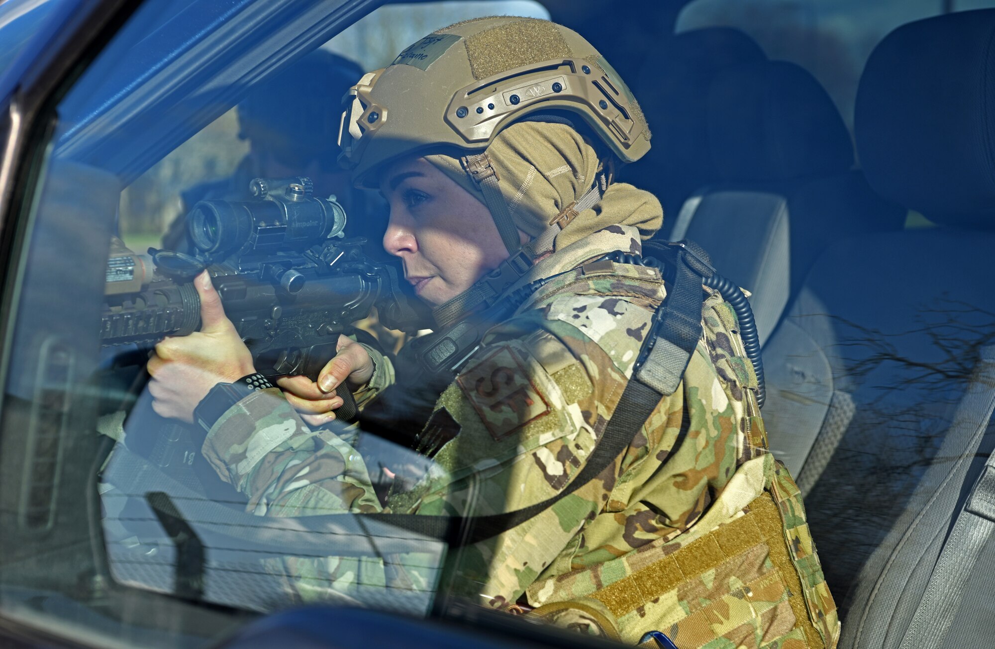 Technical Sgt. Jessica Vizcaino, 100th Security Forces Squadron flight chief, checks and clears a vehicle-borne improvised explosive device scene during a readiness exercise at RAF Mildenhall, England, Feb. 11, 2020. The main purpose of the exercise was to demonstrate how rapidly Bloody Hundredth Airmen are able to organize an entire wing and deal with simulated real-world scenarios. (U.S. Air Force photo by Senior Airman Brandon Esau)