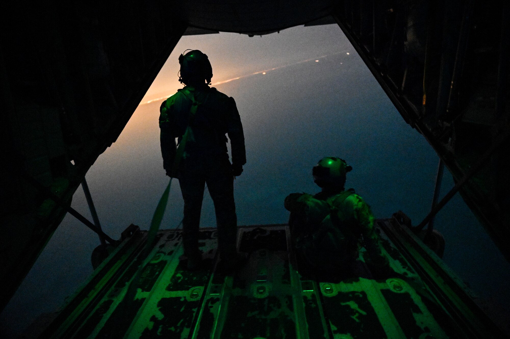 U.S. Air Force HC-130J Combat King II loadmasters with the 79th Expeditionary Rescue Squadron, deployed to Al Udeid Air Base, Qatar, observe their airspace during a personnel recovery training mission over the Arabian Gulf, Feb. 6, 2020.