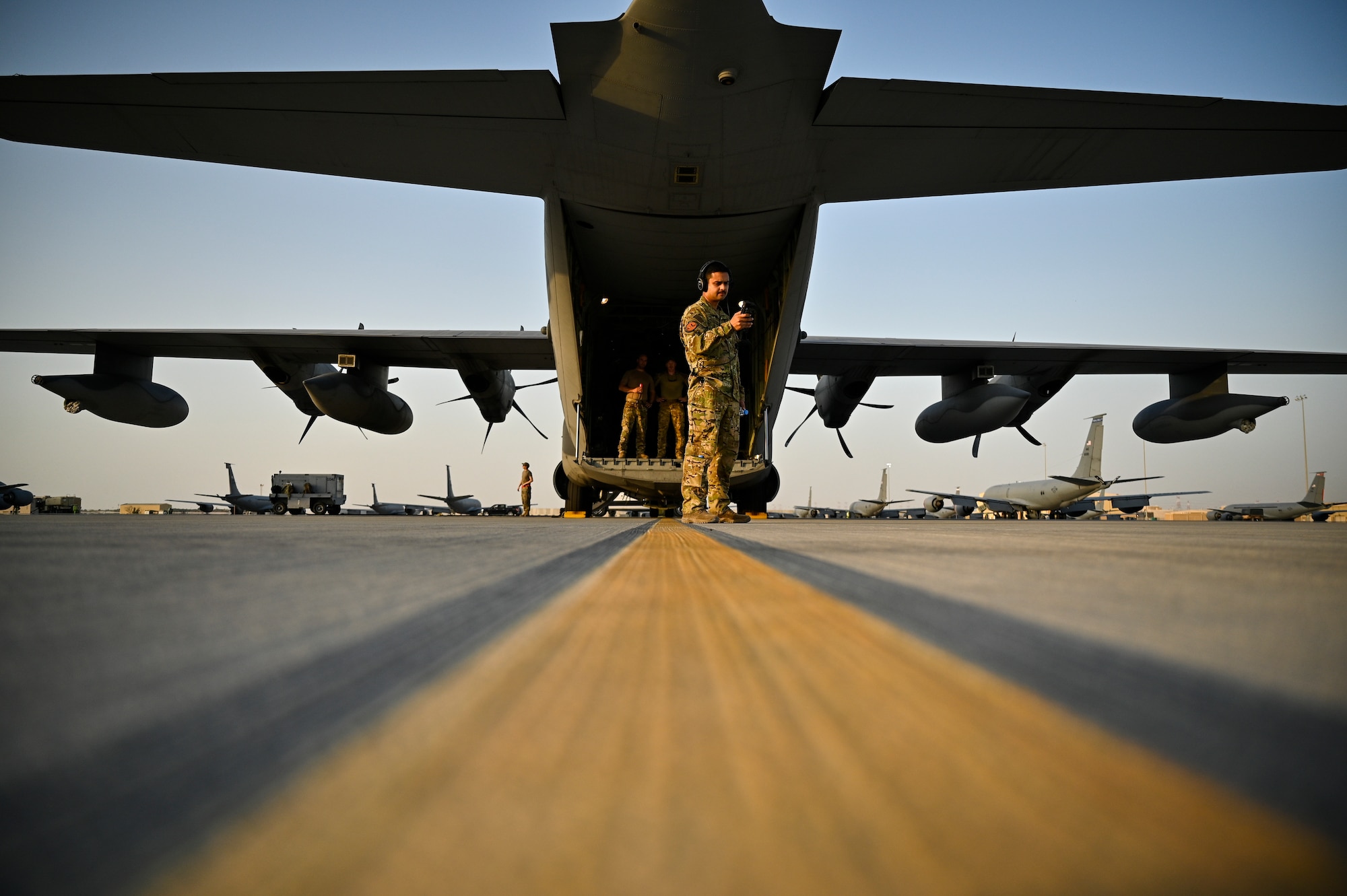 A U.S. Air Force HC-130J Combat King II pilot with the 79th Expeditionary Rescue Squadron, deployed to Al Udeid Air Base, Qatar, prepares equipment before a personnel recovery training mission at Al Udeid AB, Feb. 6, 2020.