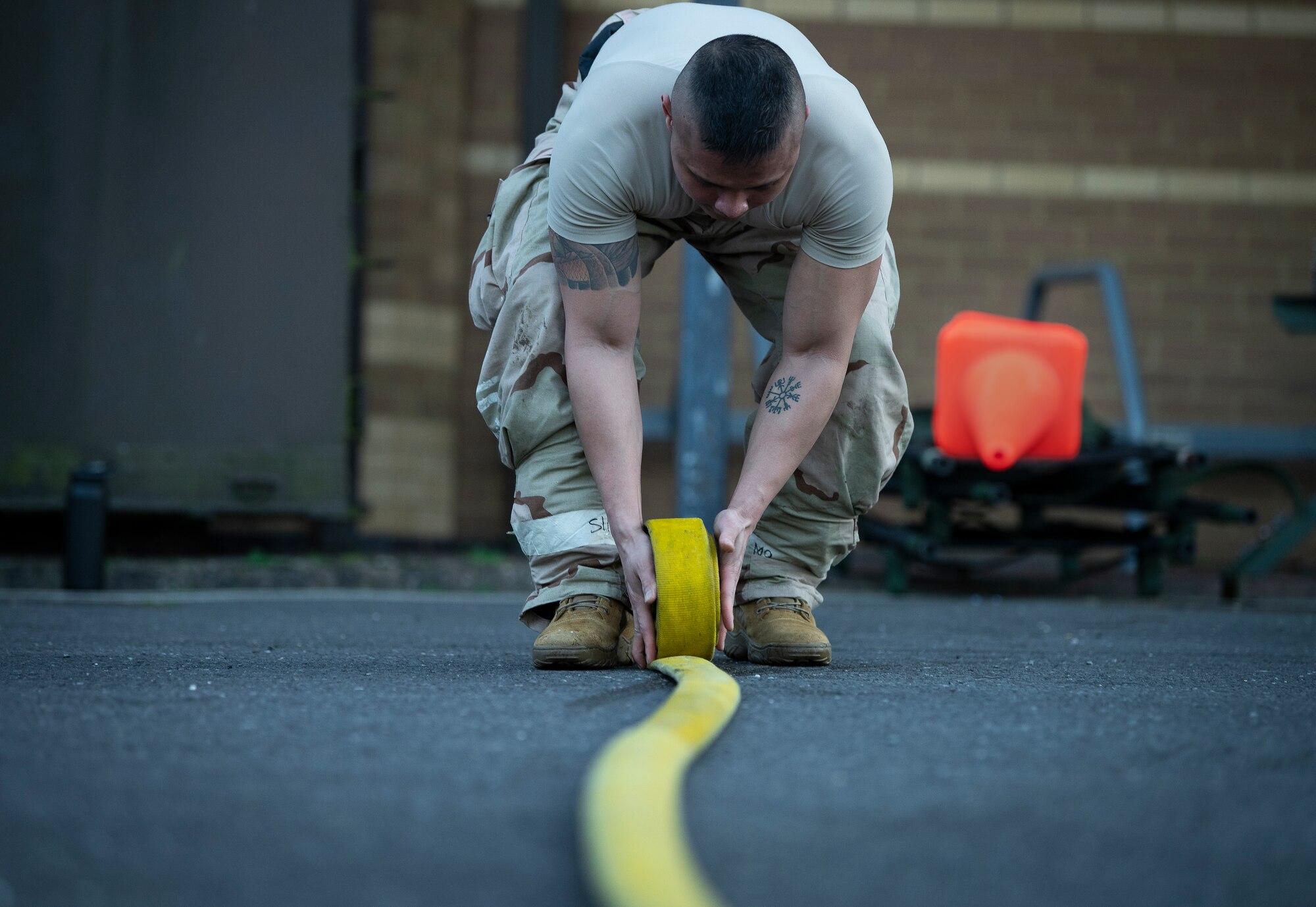 An Airman assigned to the 48th Medical Group cleans up a decontamination zone during a ‘Furious 48’ exercise at Royal Air Force Lakenheath, England, Feb. 12, 2020.  Exercises like this provide both aircrew and support personnel stationed at the Liberty Wing the experience needed to maintain a ready force capable of operating and surviving in any contingency environment. (U.S. Air Force photo by Airman 1st Class Madeline Herzog)