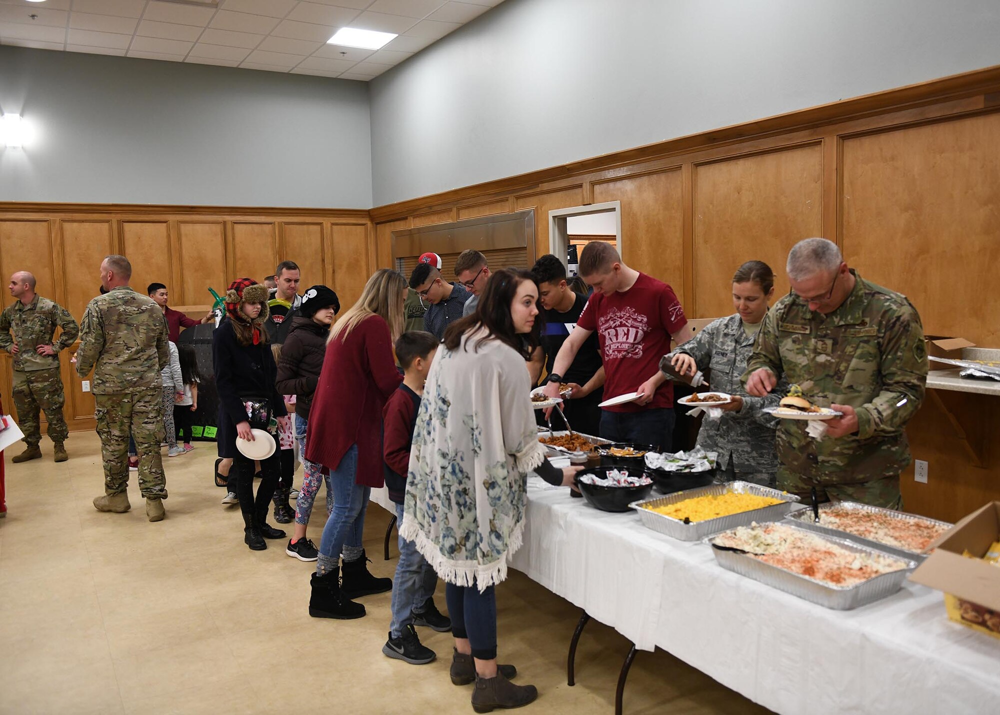 Airmen come together for a deployed family dinner social event