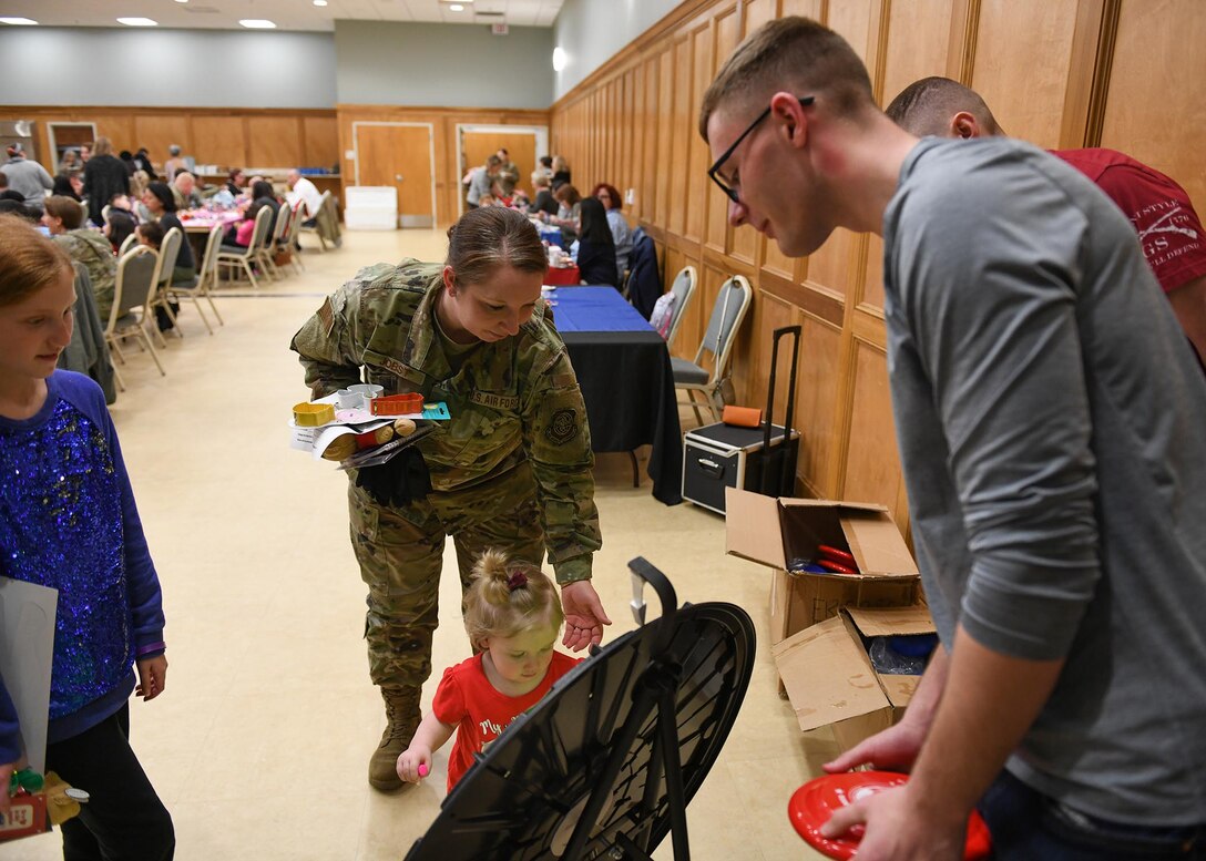 Airmen come together for a deployed family dinner social event
