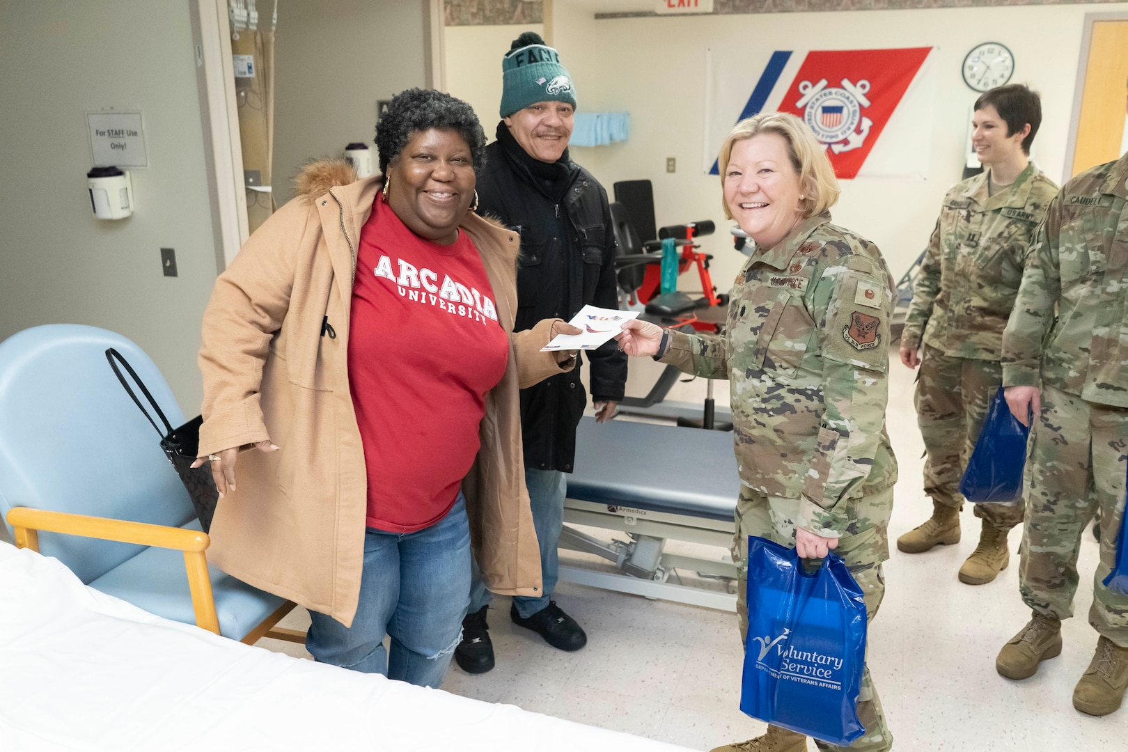 Air Force Lt. Col. Susan McMullen, a DLA Troop Support project manager, right, hands a veteran patient a Valentine’s Day card at the at the Corporal Michael J. Crescenz Veterans Affairs Medical Center, Feb. 10, 2020 in Philadelphia.