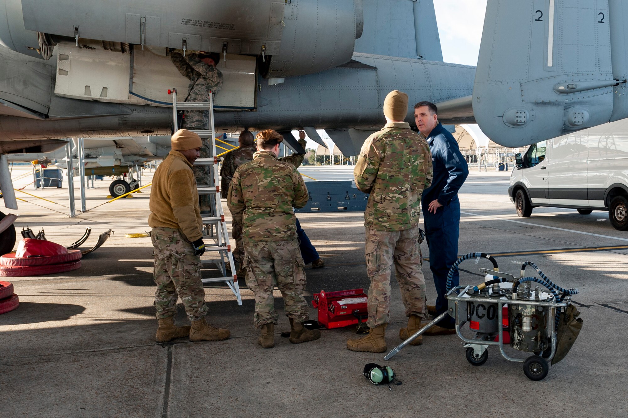 Photo of Airmen explaining inspection procedures to Col. Walls